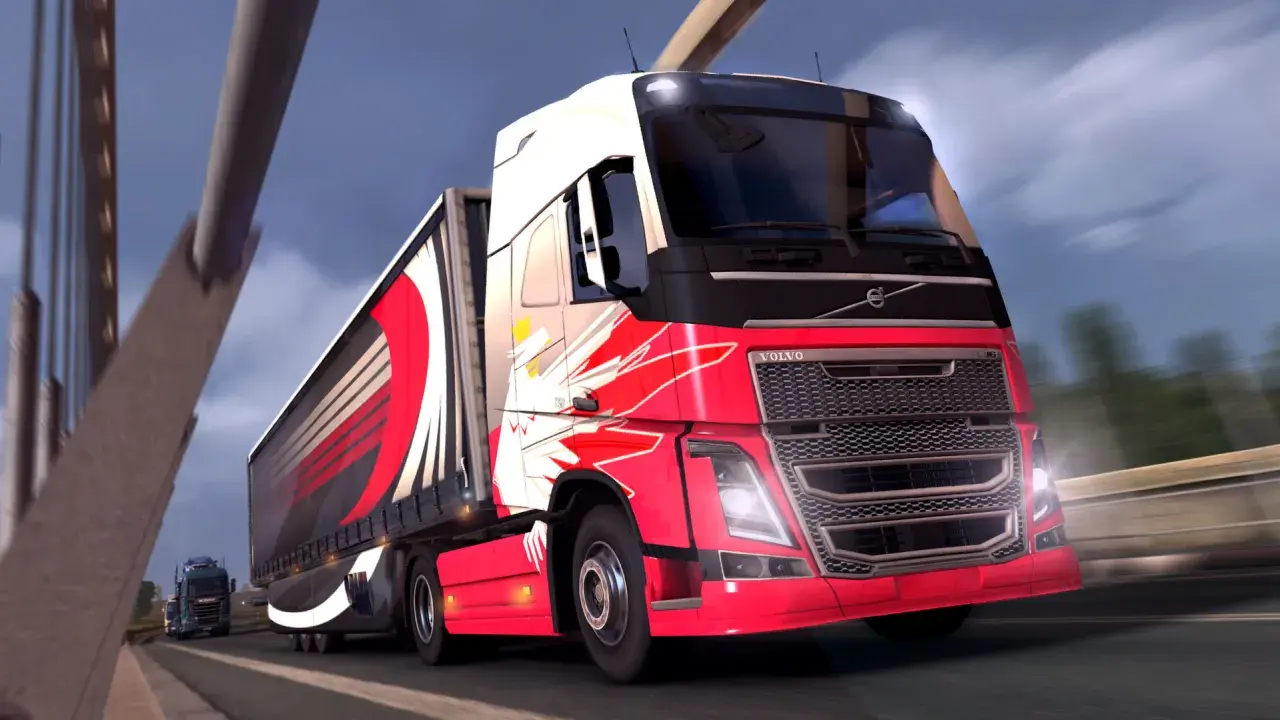 Czerwone ciężarówki ets2 z efektownymi grafikami pędzą po autostradzie.