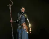 Czarodziejka z Diablo 4 w niebieskiej szacie i z kosturem, gotowa do walki. Idealny diablo 4 czarodziej build.