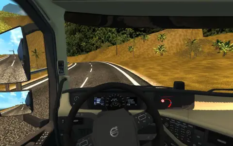 Widok z kabiny ciężarówki w ETS2. Widać kierownicę, deskę rozdzielczą z prędkościomierzem i obrotomierzem, a także lusterka boczne. Na drodze widać znak ograniczenia prędkości 60. Retarder jest kluczowy na zjazdach.