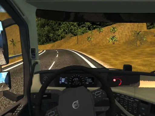 Widok z kabiny ciężarówki w ETS2. Widać kierownicę, deskę rozdzielczą z prędkościomierzem i obrotomierzem, a także lusterka boczne. Na drodze widać znak ograniczenia prędkości 60. Retarder jest kluczowy na zjazdach.