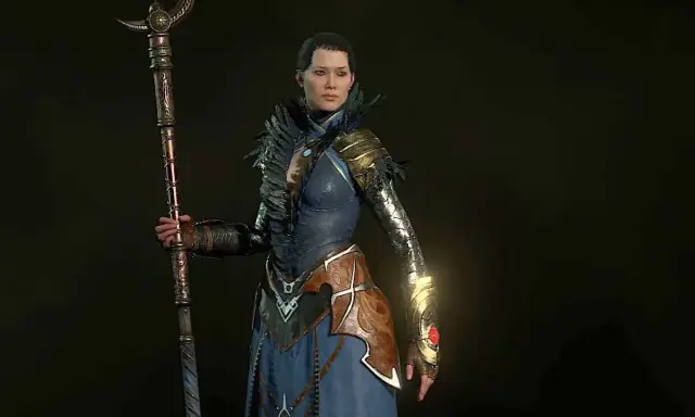 Czarodziejka z Diablo 4 w niebieskiej szacie i z kosturem, gotowa do walki. Idealny diablo 4 czarodziej build.