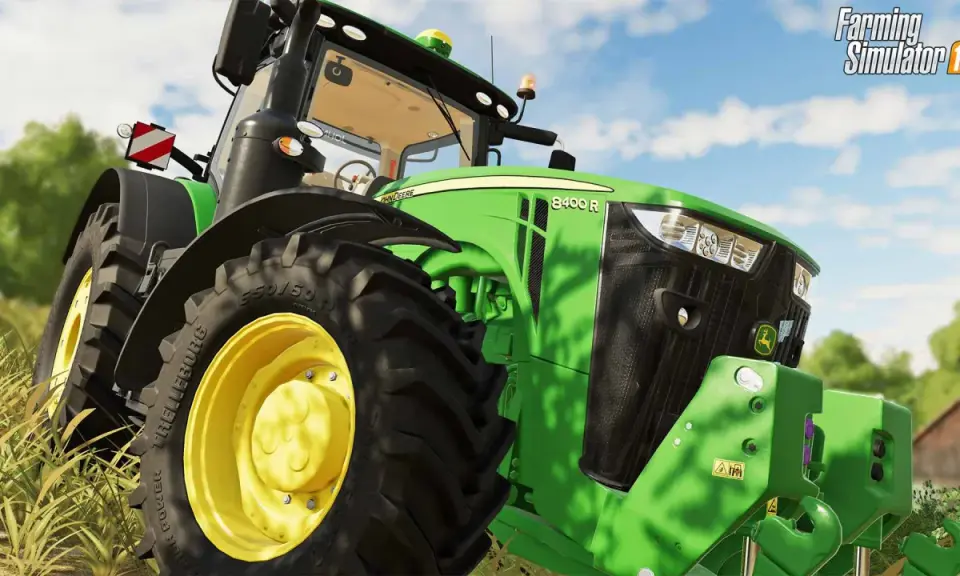 Zielony traktor John Deere 8400 R z gry ls19 na polu.