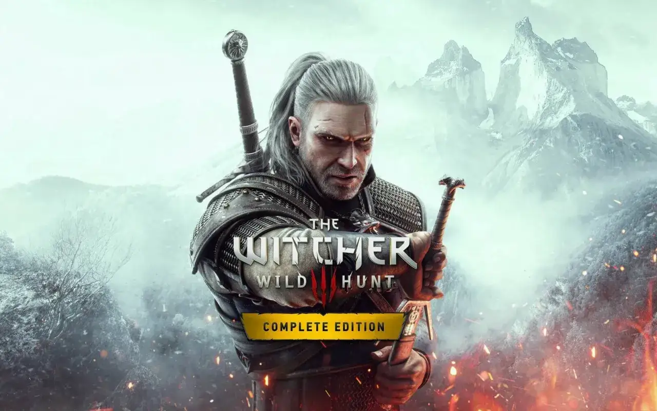 Geralt z Rivii, dzierżący sw&oacute;j miecz, gotowy do walki w mroźnym krajobrazie. Okładka gry 